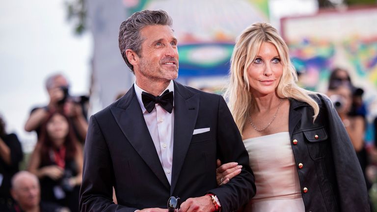 Patrick Dempsey, left, and Jillian Fink pose for photographers upon arrival for the premiere of the film 'Ferrari' during the 80th edition of the Venice Film Festival in Venice, Italy, on Thursday, Aug. 31, 2023. (Photo by Vianney Le Caer/Invision/AP)