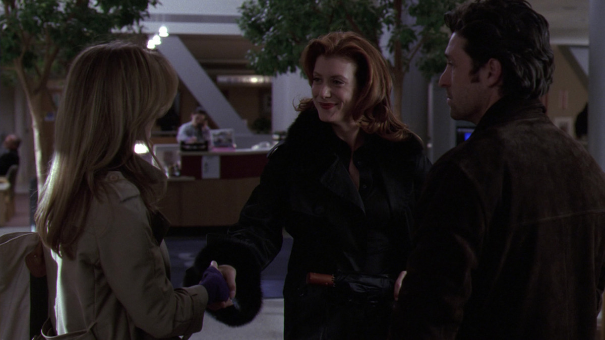 Addison greets Meredith as Derek watches