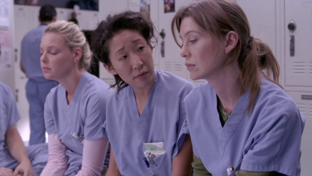 Meredith sits with Cristina and Izzie