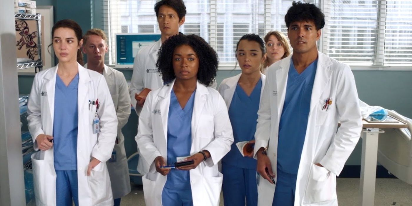 the interns standing in a group looking unsettled in Grey's Anatomy season 19