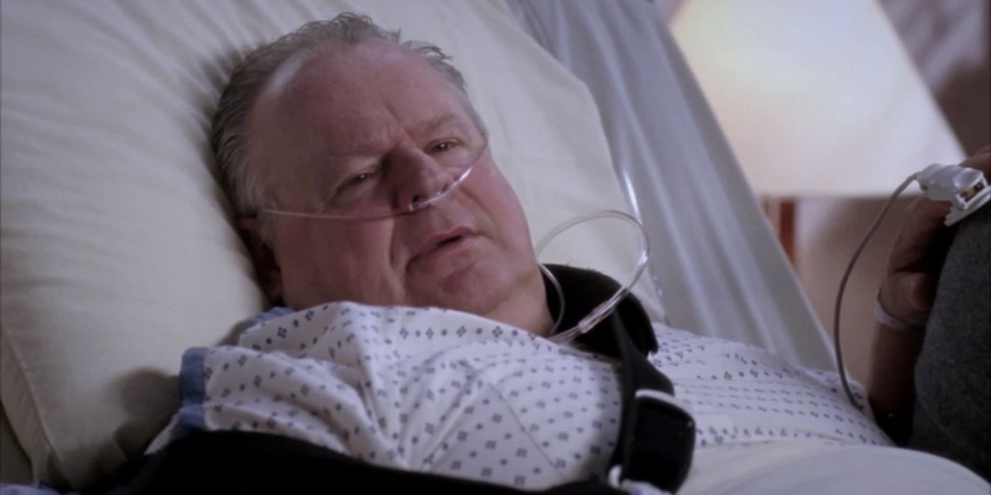 George Dzundza as Harold O'Malley in Grey's Anatomy, lying in a hospital bed