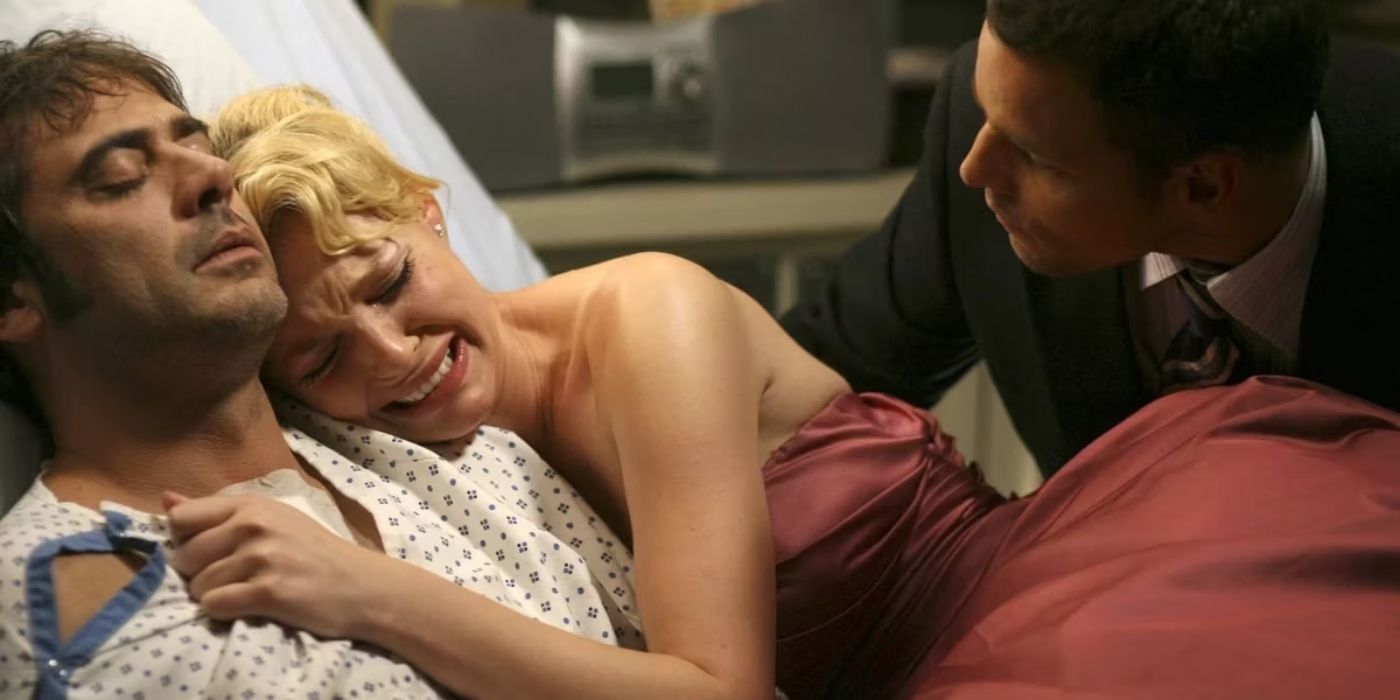 Katherine Heigl as Izzie Stevens in Grey's Anatomy holding onto Denny, Alex taking her away